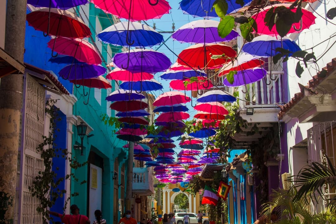 Colorful umbrellas strung over a street in Getsemaní, Cartagena