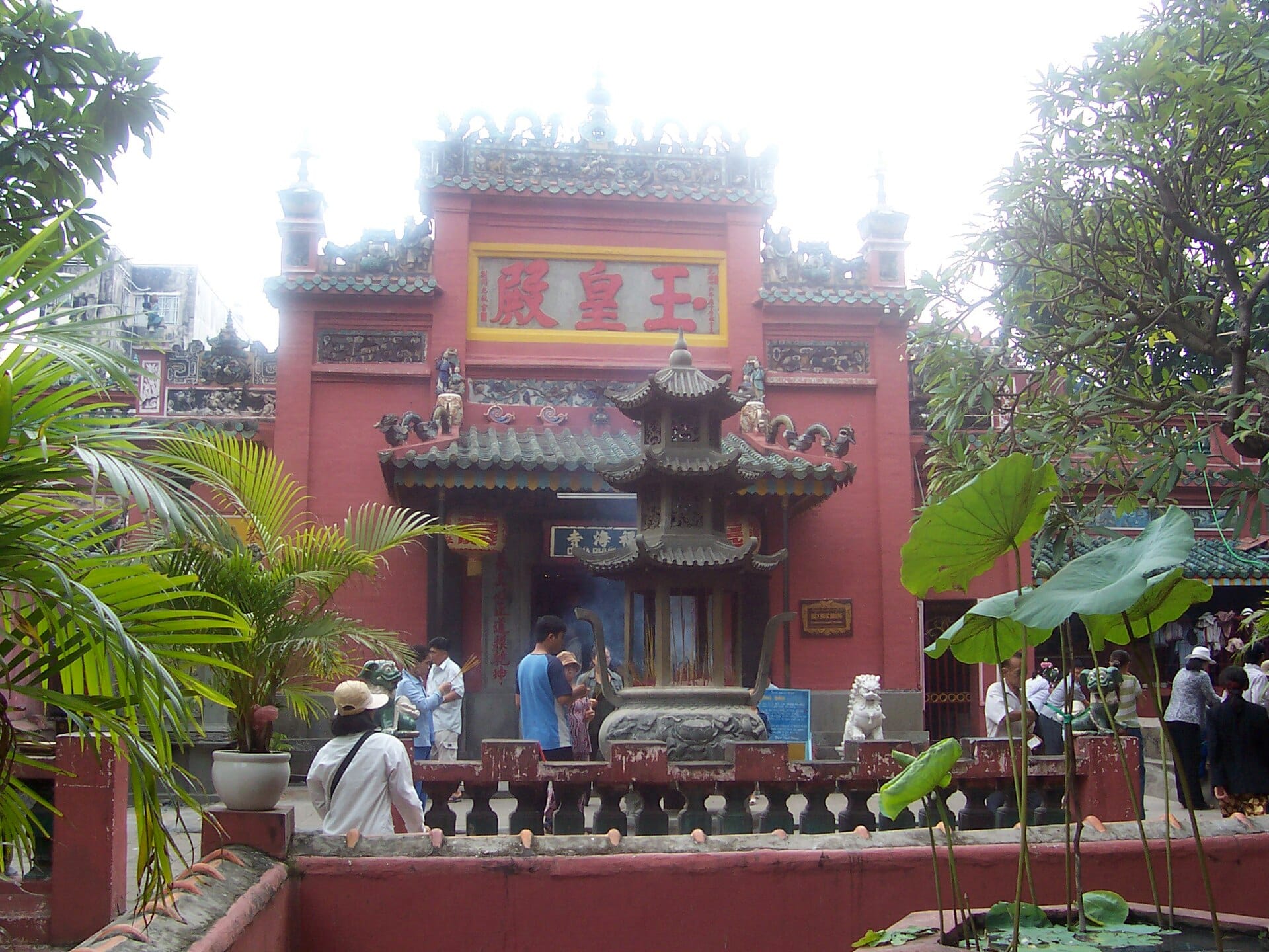 Incense and carved statues inside the Jade Emperor Pagoda in Da Kao