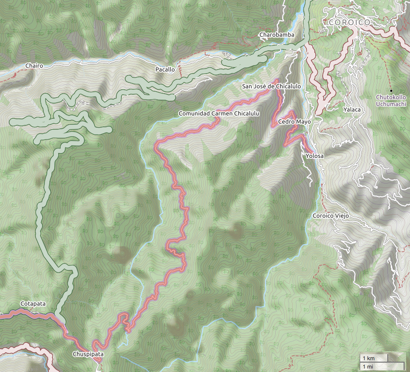 The North Yungas 'Death Road' cut into the green mountainside of the Bolivian Yungas