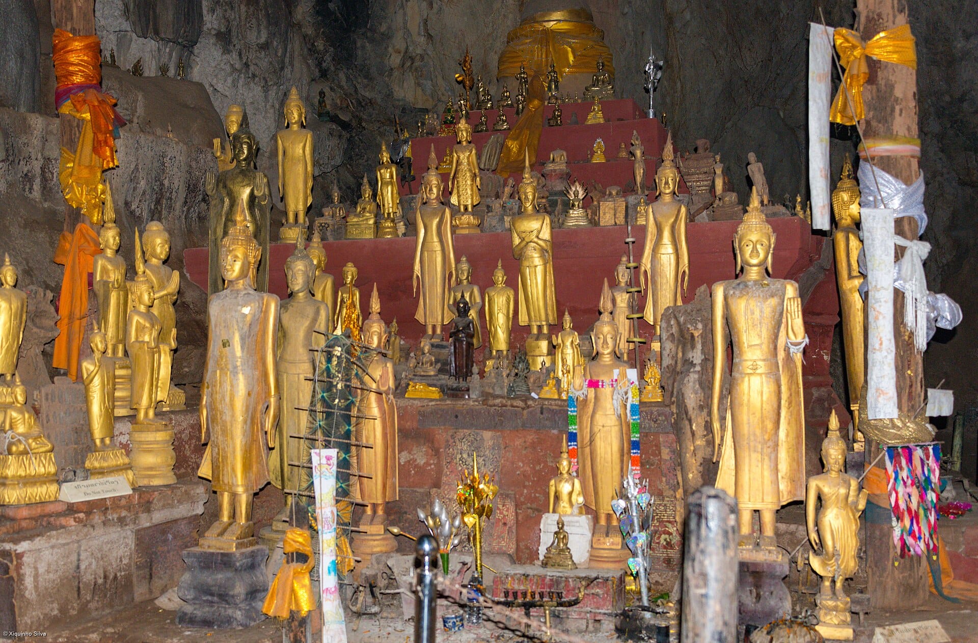 Rows of Buddha statues inside the Pak Ou Caves on the Mekong