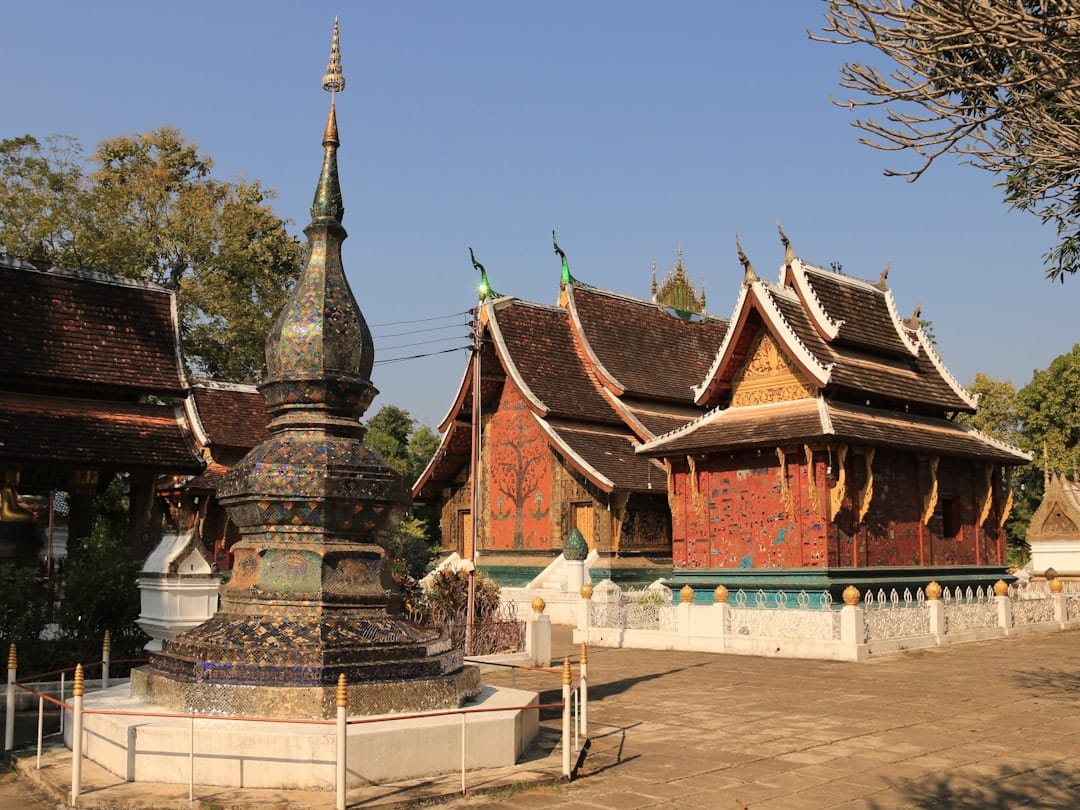 Wat Xieng Thong temple with its low sweeping roofline in Luang Prabang
