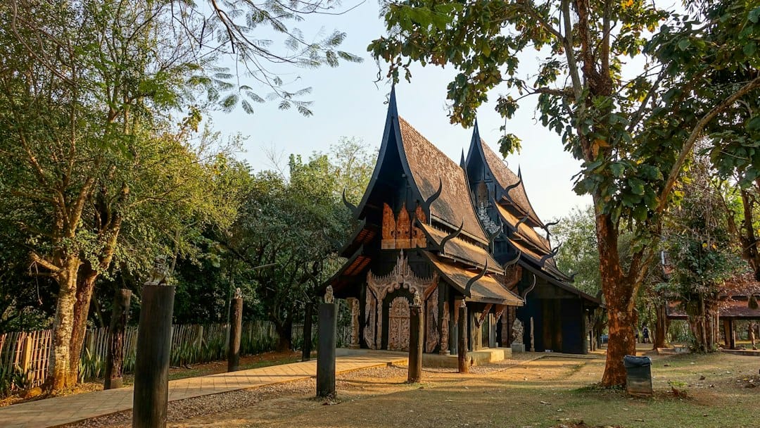 A black Lanna-style timber building at Baan Dam, the Black House museum near Chiang Rai