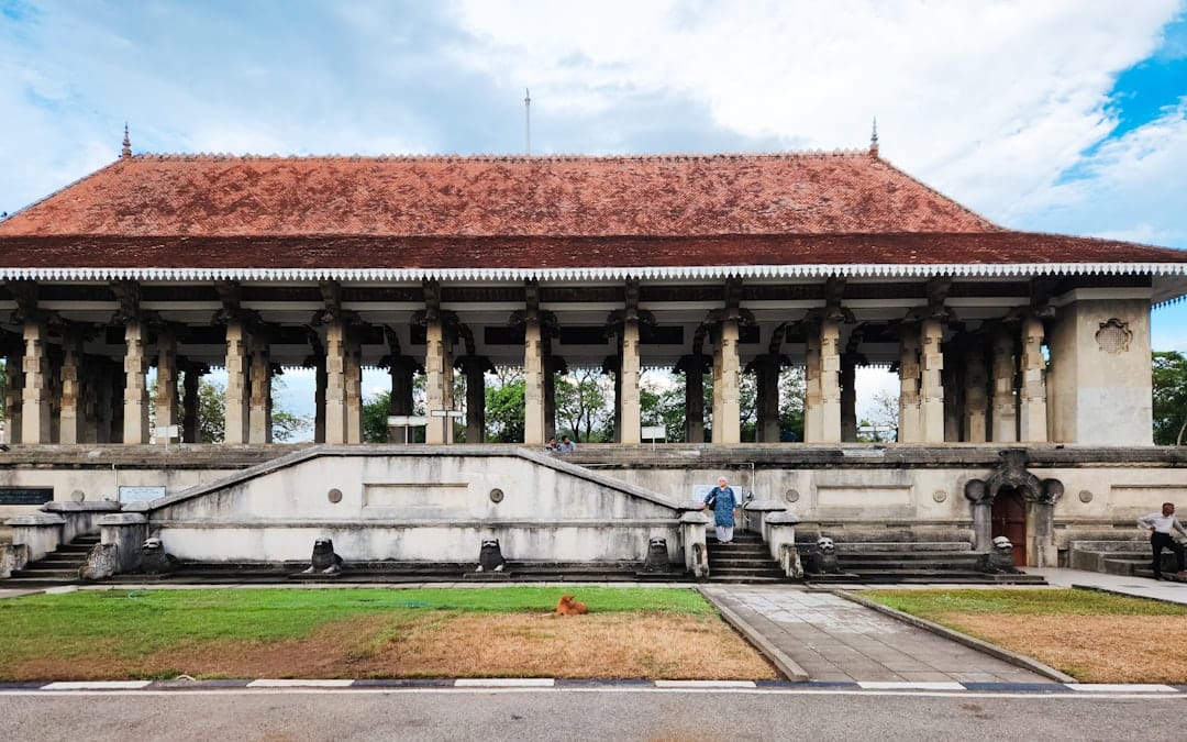 A colonial building with columns and a red roof at Independence Square, Colombo