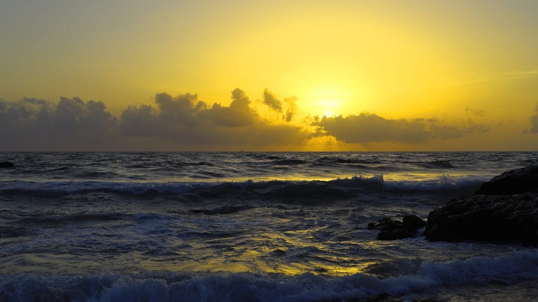 Sunset over the ocean at Mount Lavinia beach near Colombo