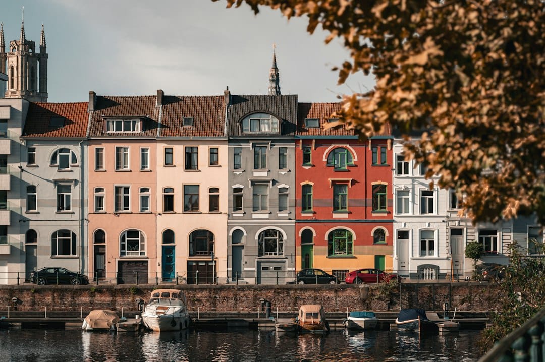 Historic guild houses lining the canal at Graslei and Korenlei in Ghent