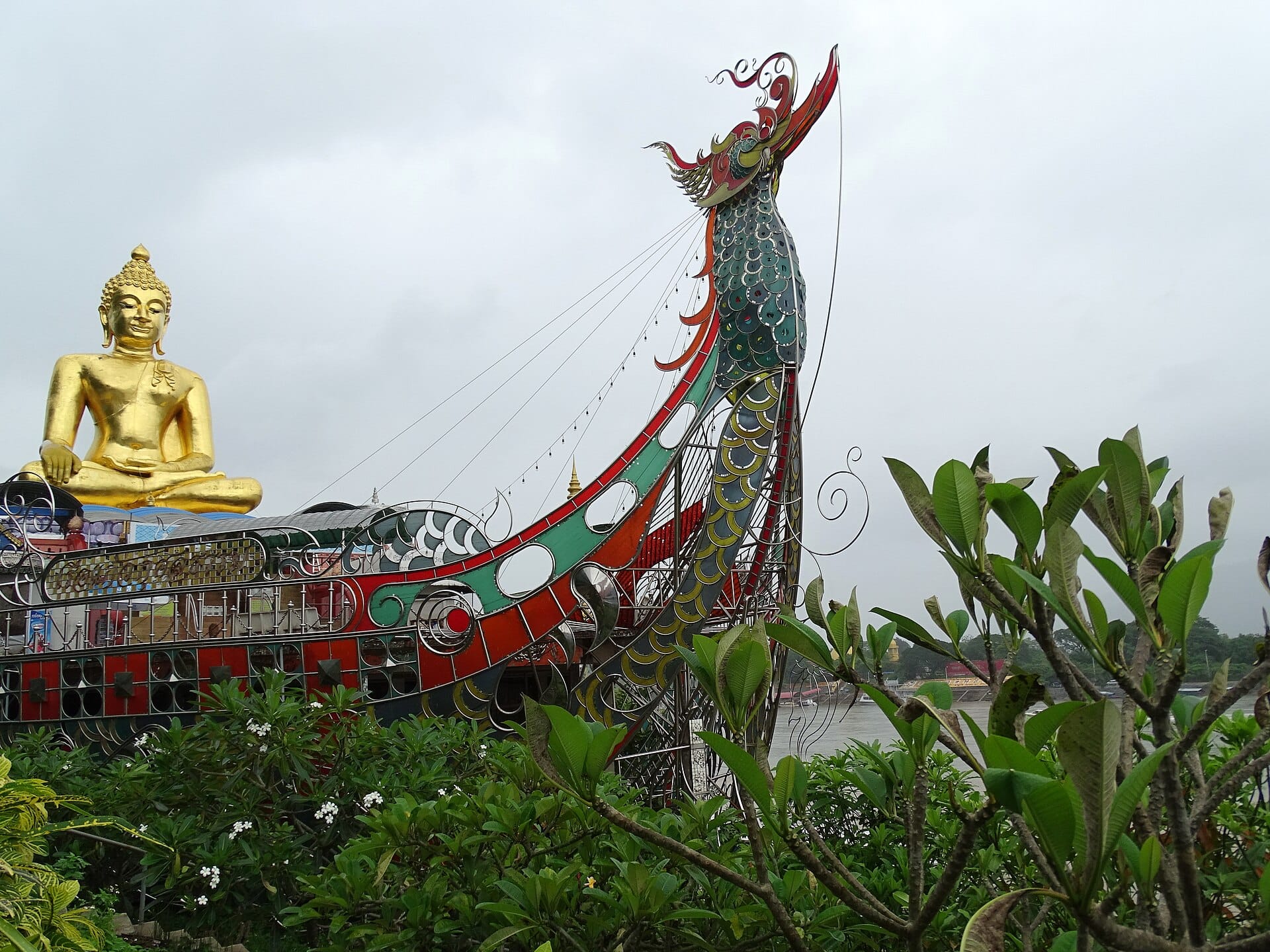 The golden Buddha and ornate boat shrine on the Mekong at Sop Ruak, the Golden Triangle