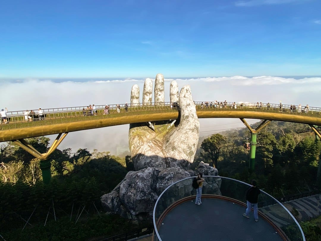 The Golden Bridge held up by two giant stone hands at Ba Na Hills