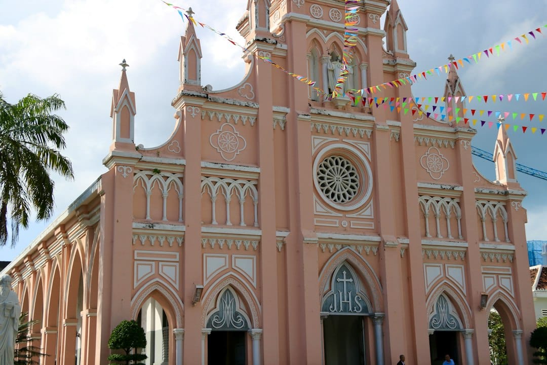 The pink façade and bell tower of Da Nang Cathedral