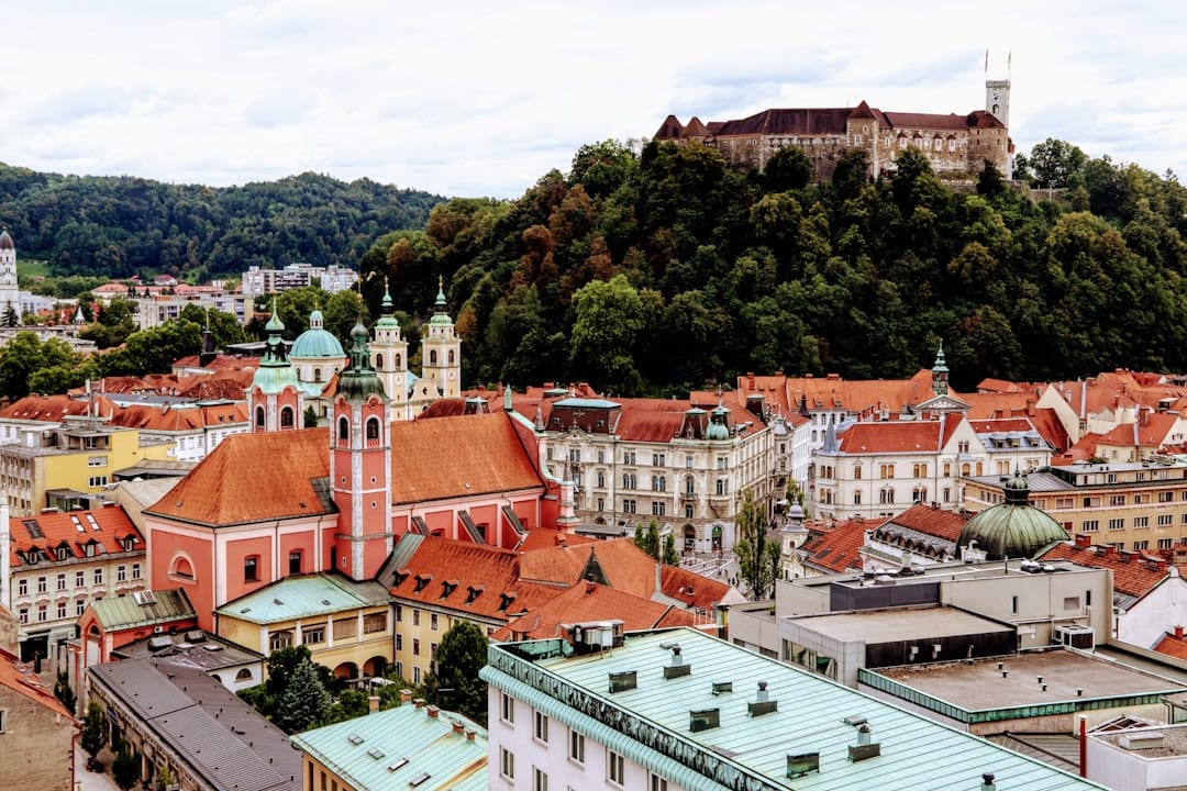 Ljubljana Castle on its wooded hill above the old town's red rooftops