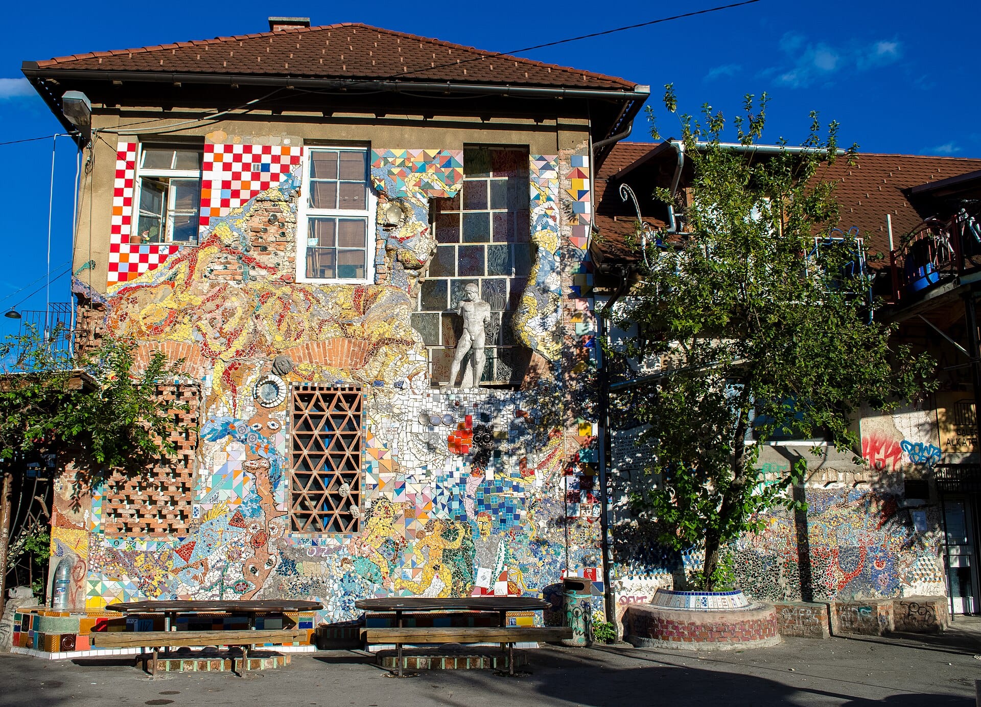 Mosaic- and sculpture-covered facades in the Metelkova autonomous cultural zone