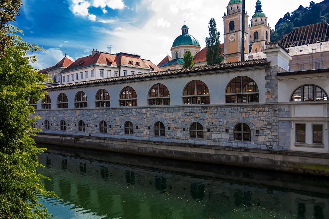 Plečnik's arched riverside Market Colonnade along the Ljubljanica