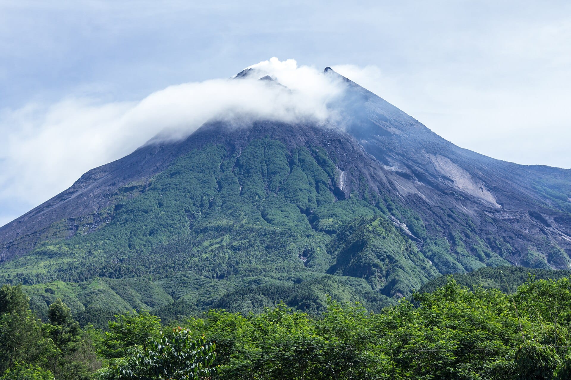 Mount Merapi volcano rising over the landscape north of Yogyakarta