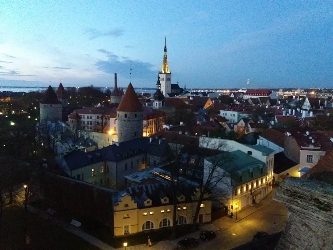 Aerial view over the medieval towers and spires of Tallinn Old Town at dusk