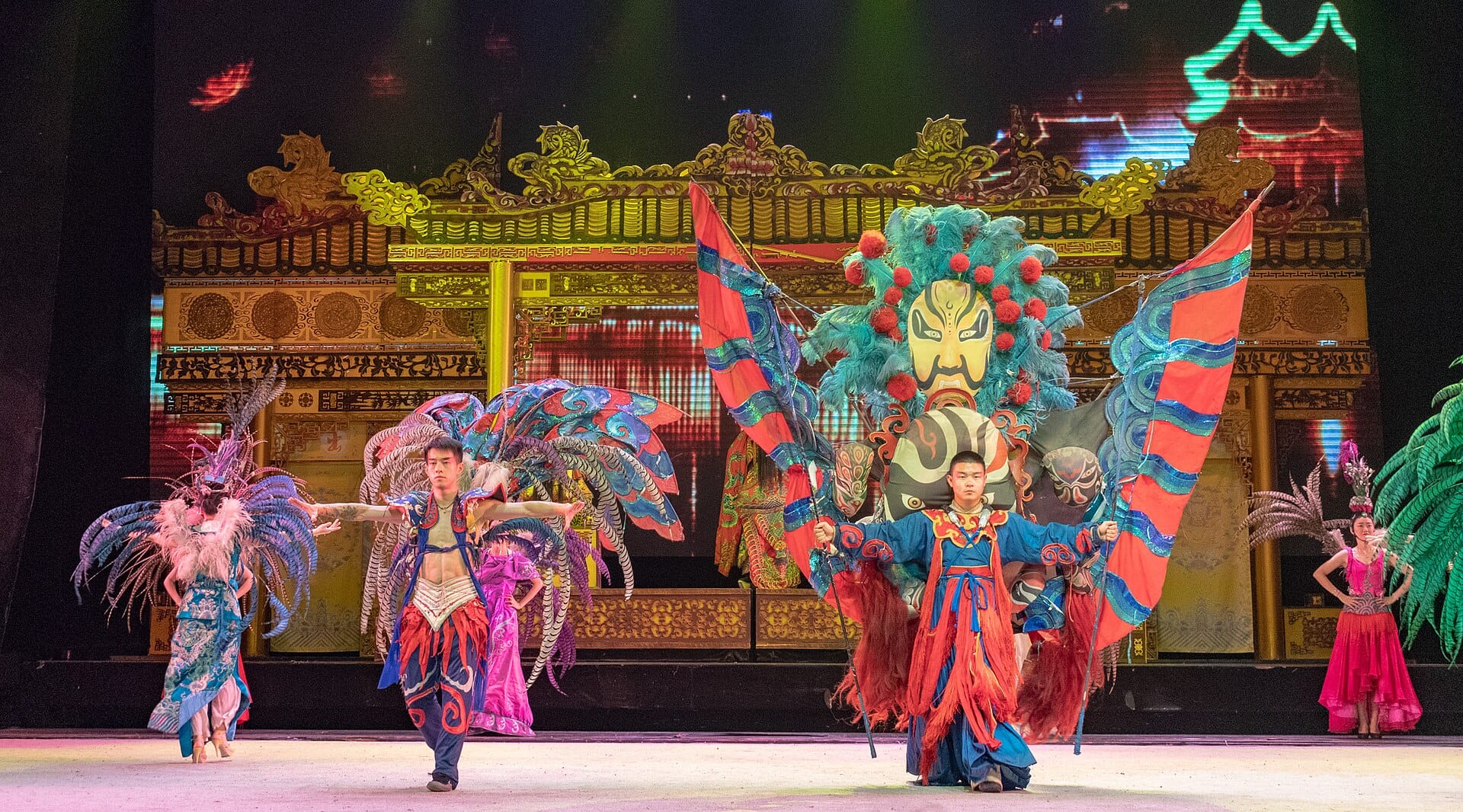 A Sichuan opera performer in a painted mask