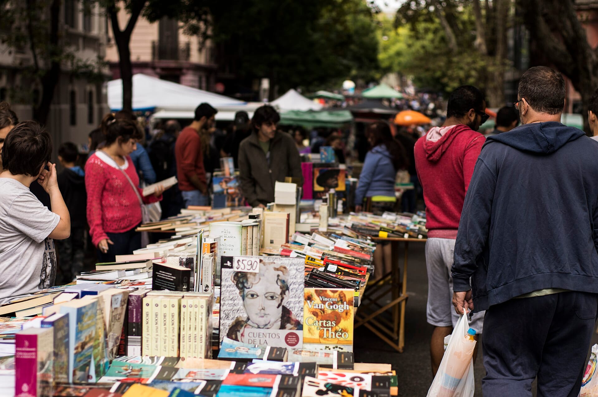 Book stalls crowded with browsers at the Feria de Tristan Narvaja street market, Montevideo