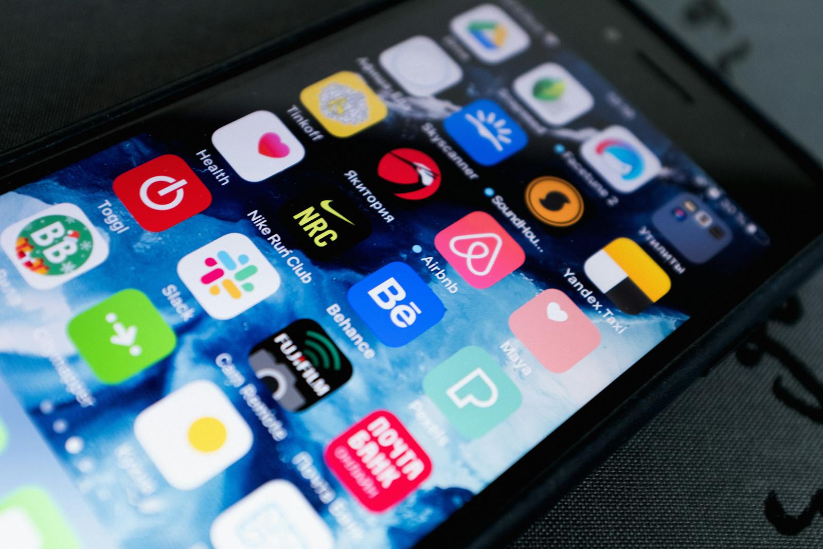 A phone showing a grid of mobile app icons