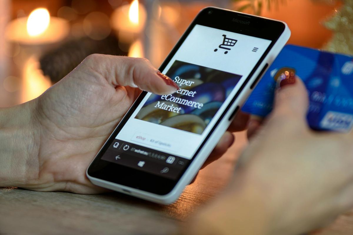A phone displaying a banking app, illustrating the digital banking landscape for a newcomer to Dubai