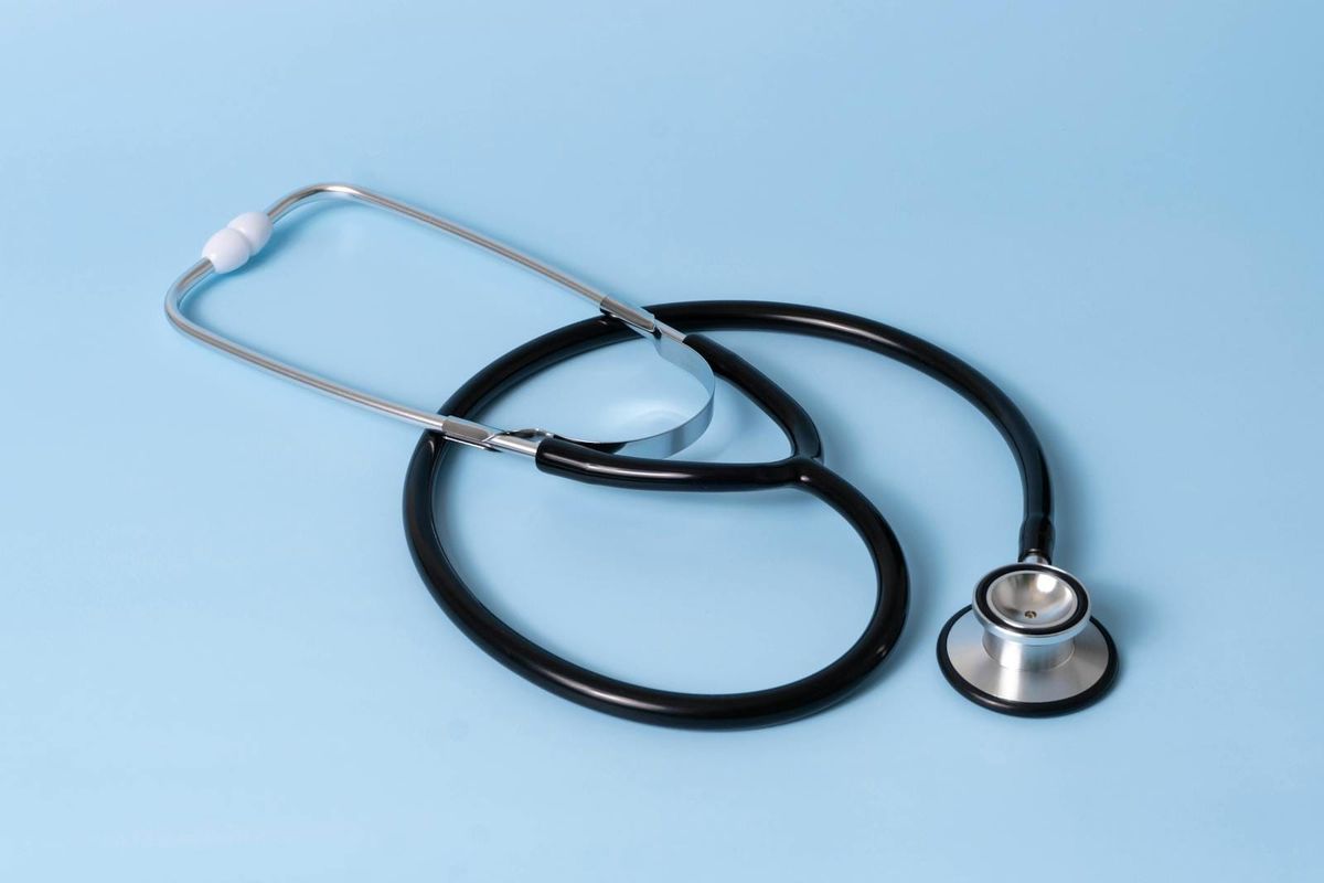 A stethoscope on a clean surface, illustrating the practical Dubai healthcare landscape for a newcomer