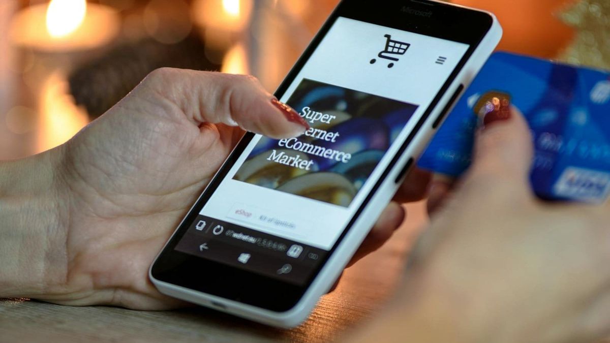 A phone displaying a banking app, illustrating the digital banking landscape for a newcomer to Dubai