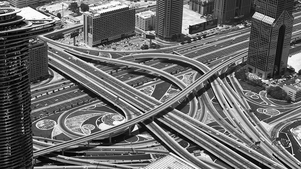 An aerial view of Sheikh Zayed Road and the Dubai skyline, generic Dubai driving illustration
