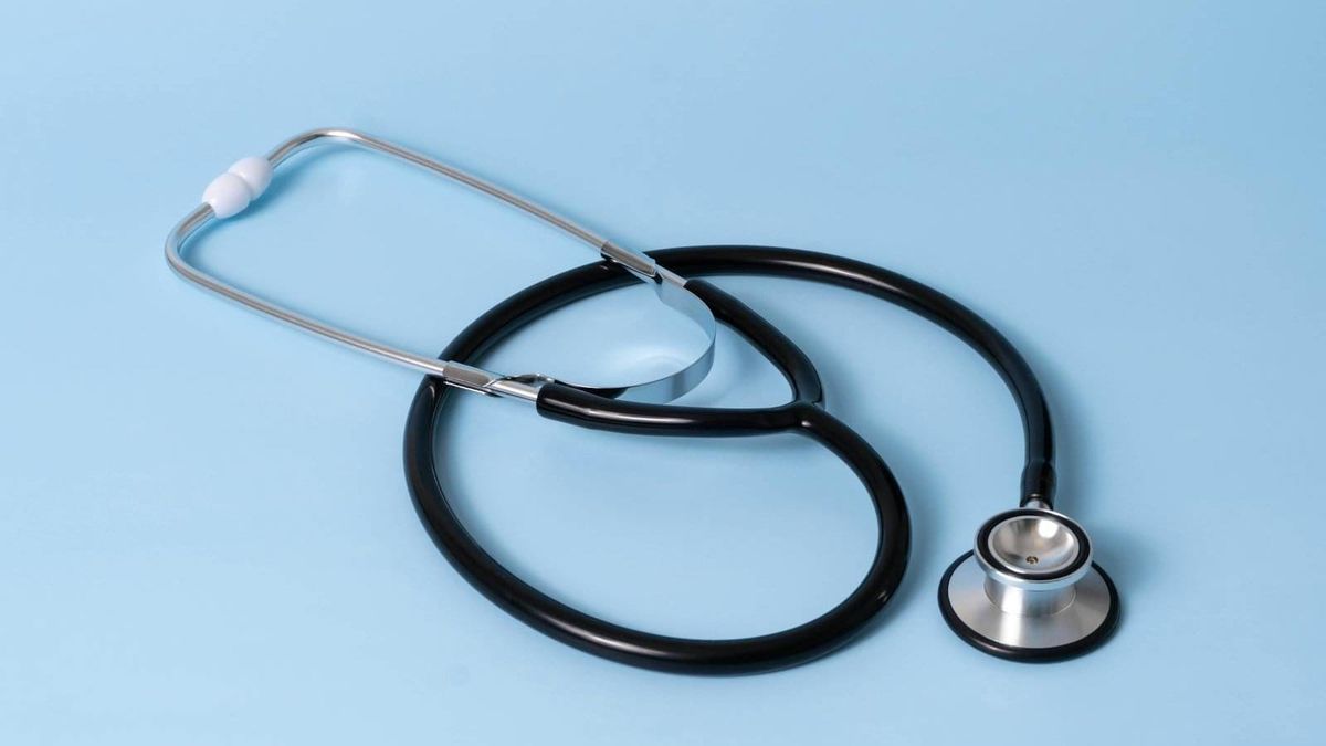 A stethoscope on a clean surface, illustrating the practical Dubai healthcare landscape for a newcomer