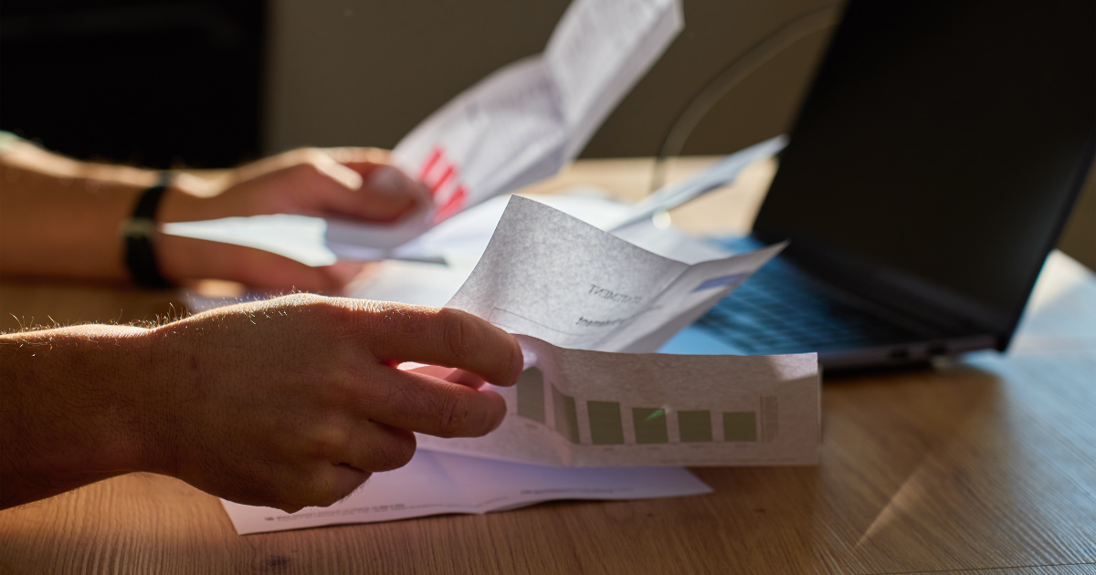 Going through statements and a letter at a desk