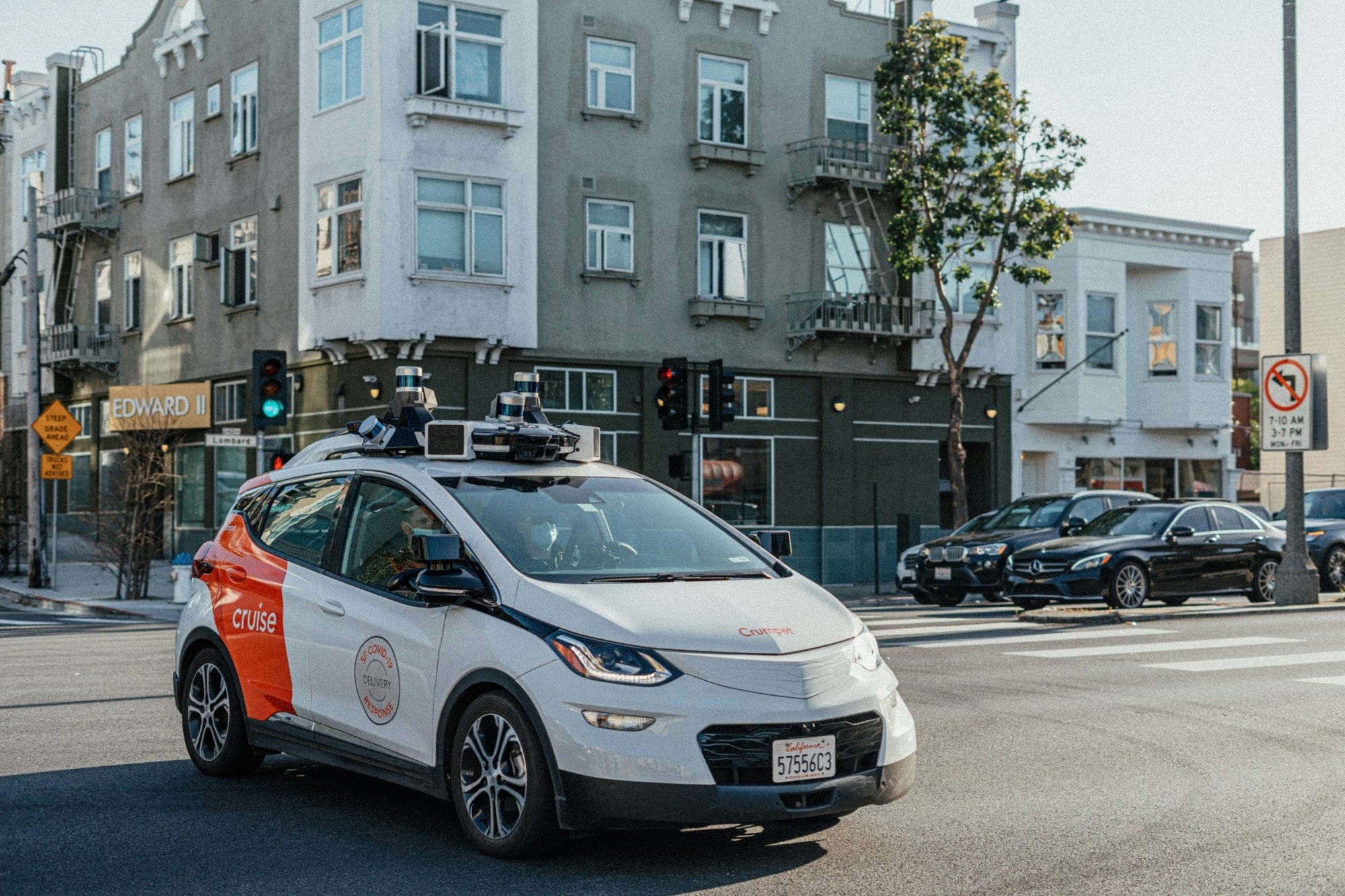 A Cruise robotaxi stopped at a city intersection