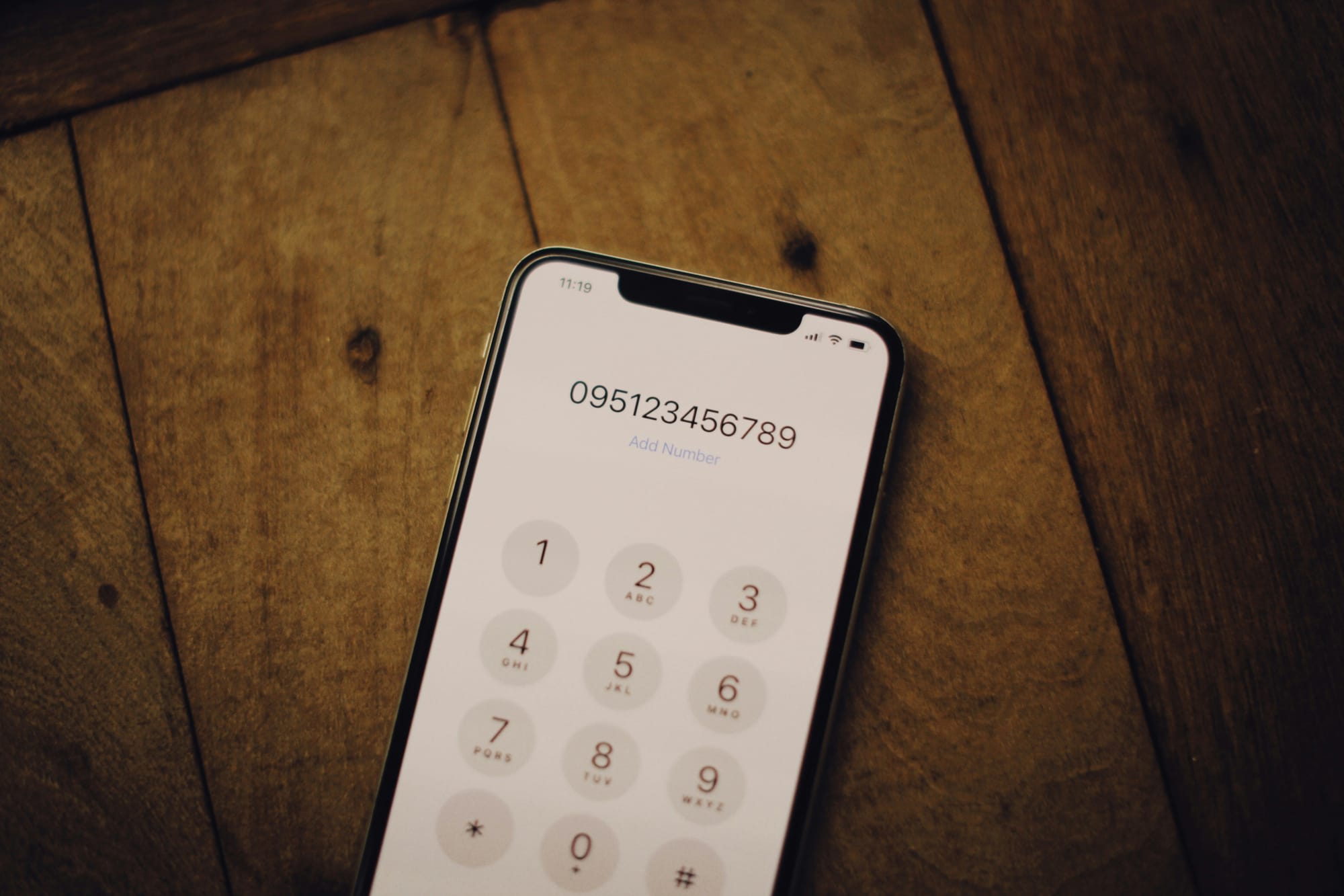 A phone number shown on a smartphone dialer screen