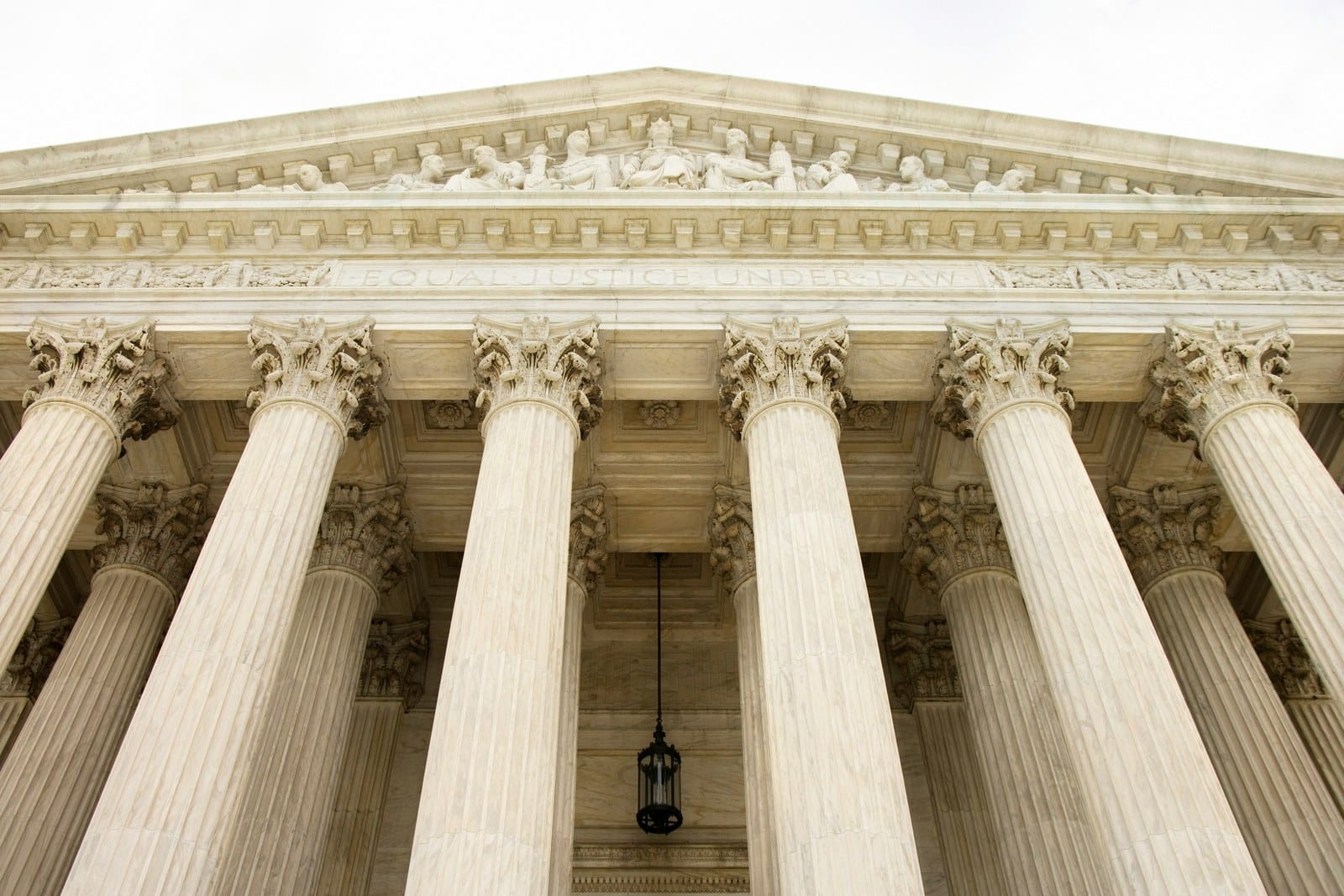 Columns and pediment of the U.S. Supreme Court building, with the words Equal Justice Under Law carved above