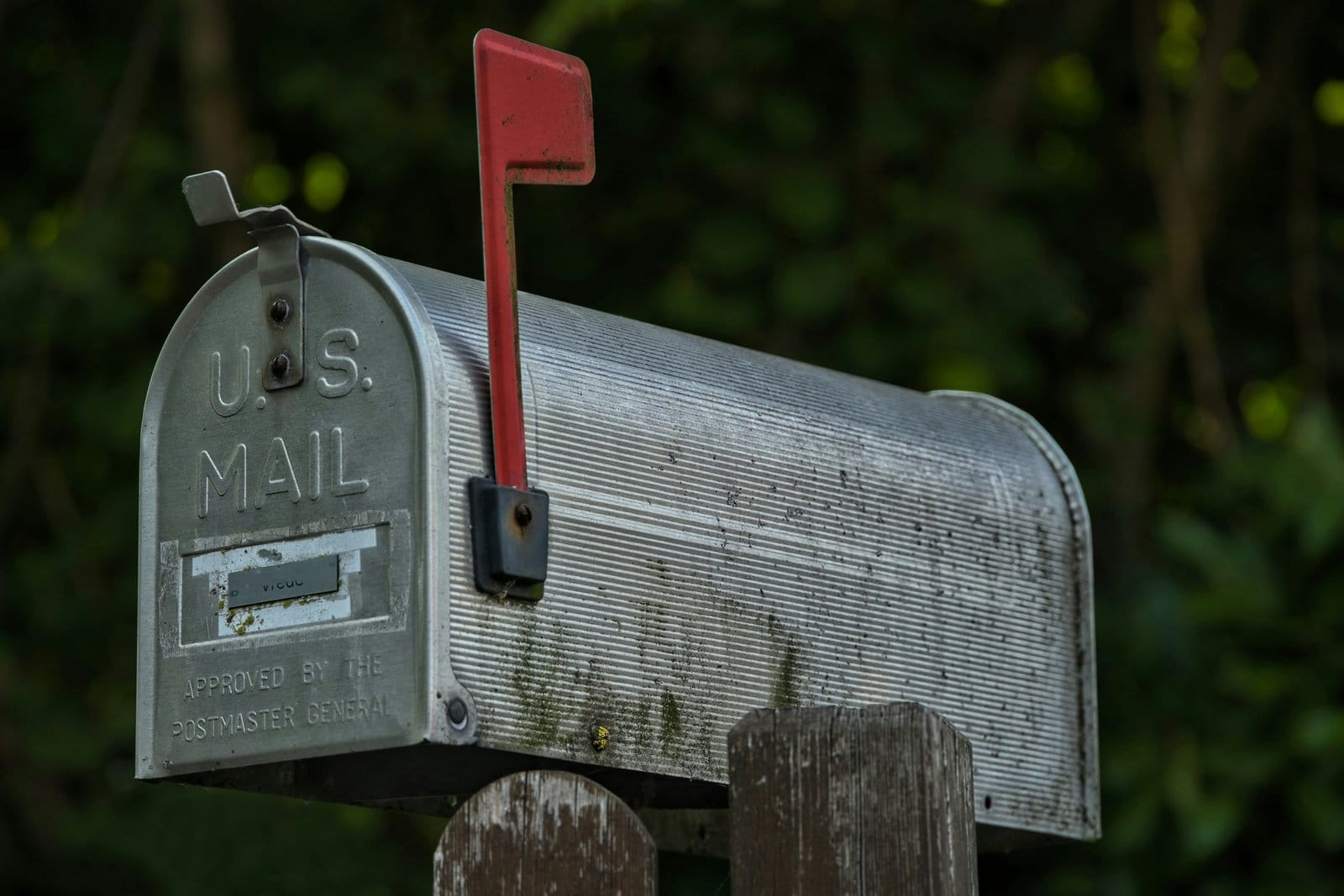 A mailbox holding a stack of envelopes