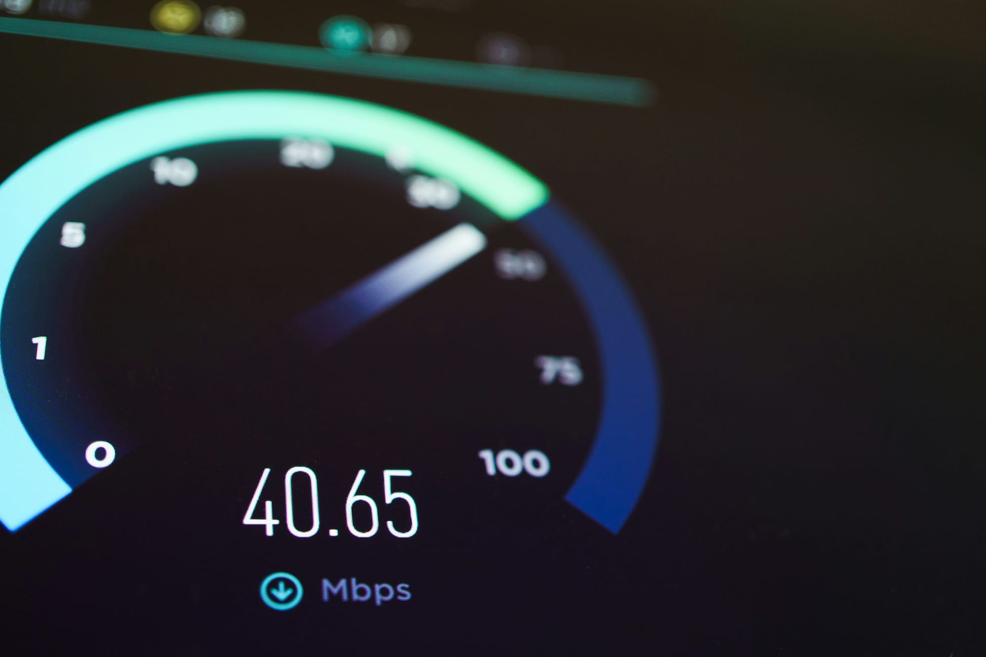 An internet speed test on screen showing 40.65 megabits per second download.
