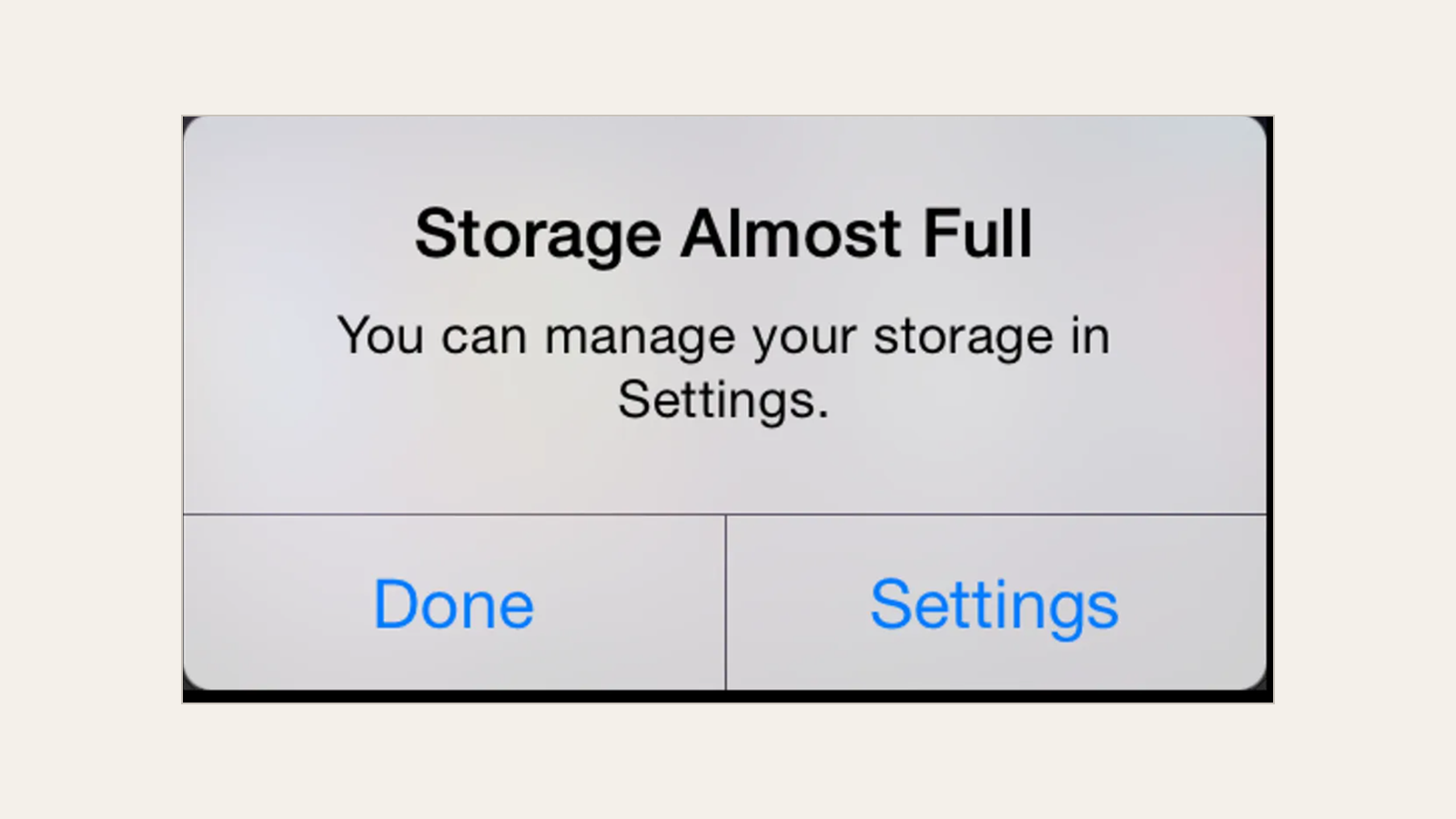 Phone alert reading Storage Almost Full, with Done and Settings buttons