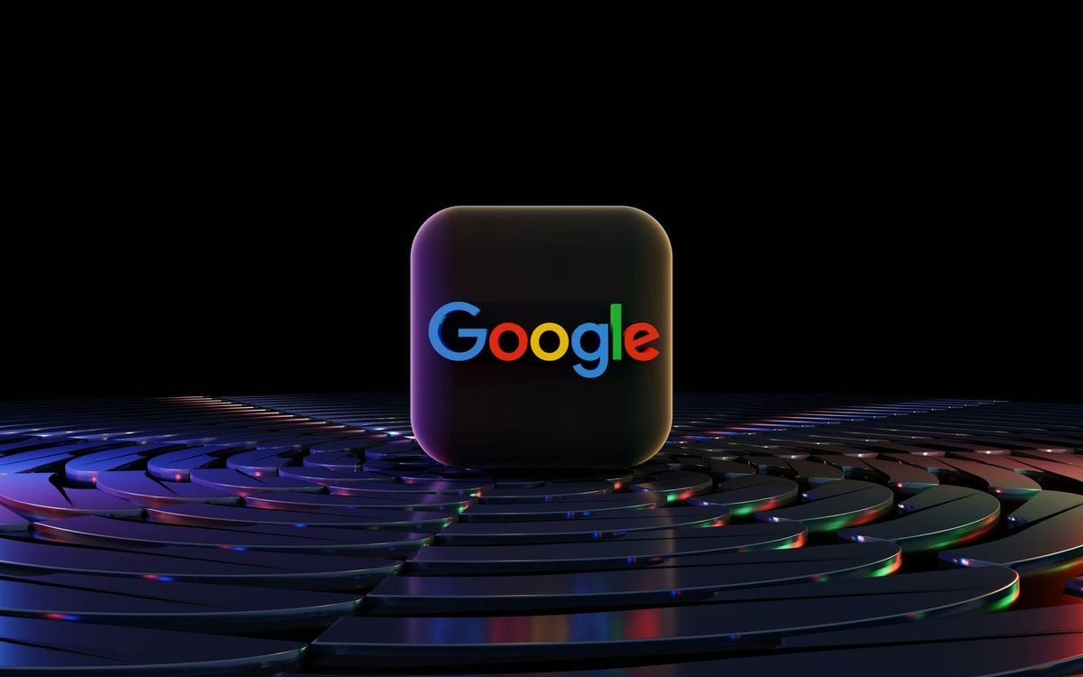 The multicolored Google logo on a dark rounded app tile, set on a ripple of metal discs that resembles a fingerprint.