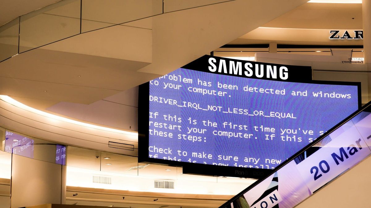 A hand holding a Samsung Galaxy phone, seen from the back.