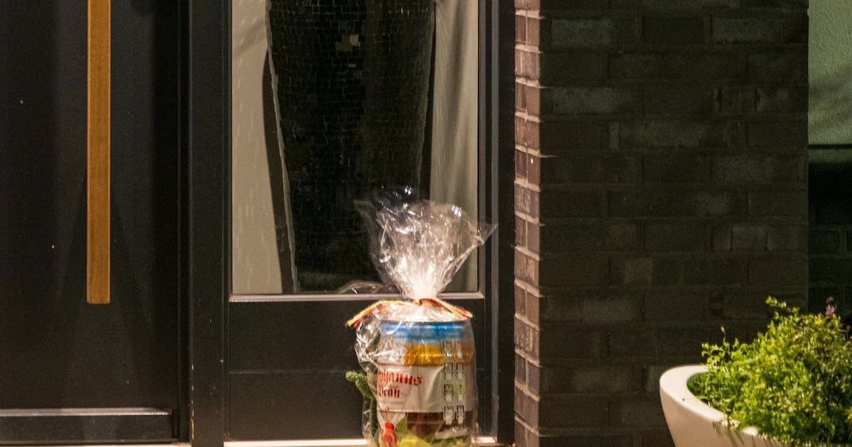 A wrapped parcel left on a doorstep. Photo by Sergej on Unsplash.