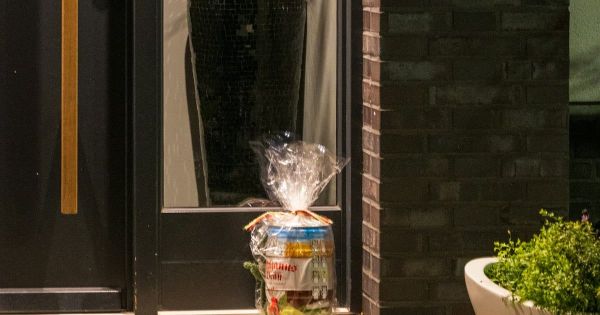 A wrapped parcel left on a doorstep. Photo by Sergej on Unsplash.