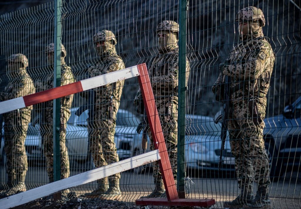 Azerbaijani soldiers at a checkpoint between Nagorno-Karabakh and Armenia.&nbsp;Photo:&nbsp;Tofik Babayev/AFP/Getty