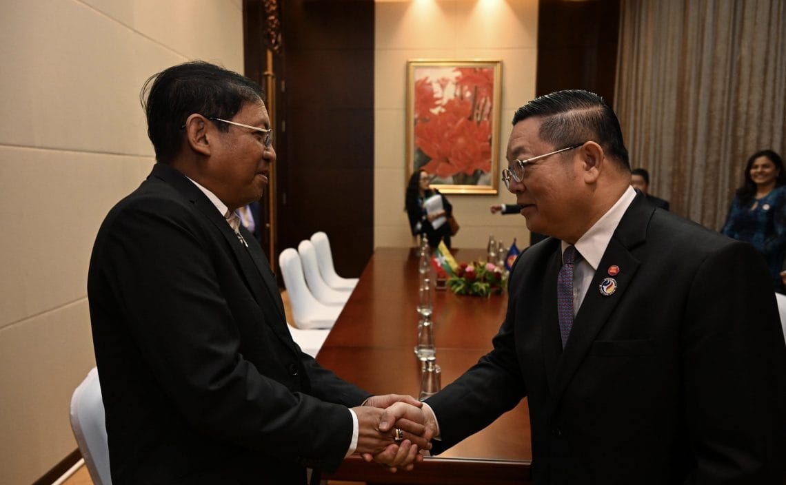 Myanmar’s Aung Kyaw Moe (left) with ASEAN’s Secretary-General Kao Kim Hourn during a bilateral meeting in July. Photo: ASEAN