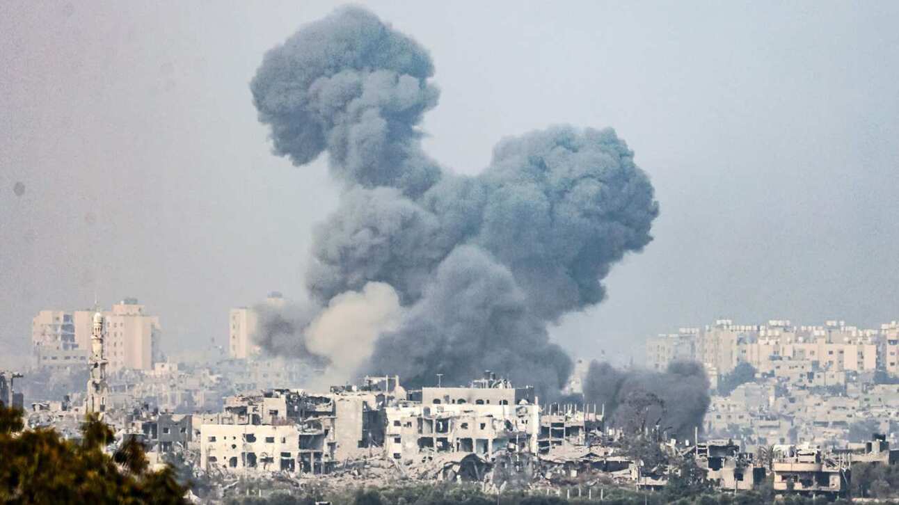Smoke rises above Gaza City after an Israeli bombardment. Photo: Hannibal Hanschke/EPA/Shutterstock