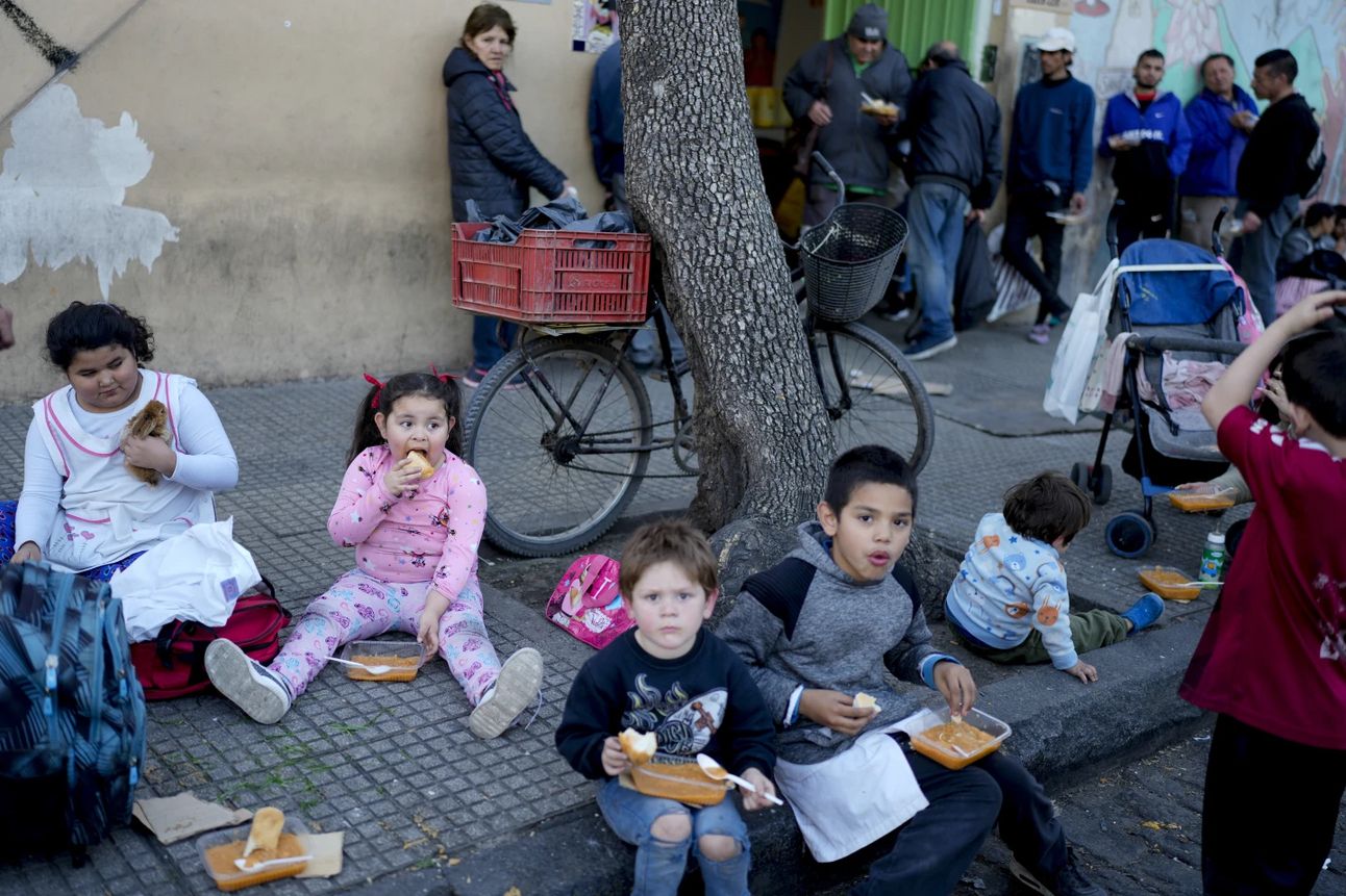 Children eating a free meal at a Buenos Aires soup kitchen. Photo: Natacha Pisarenko/AP