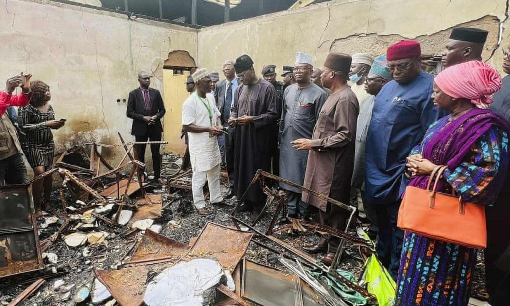 Electoral commission staff assess damage after an attack in Abeokuta, Nigeria. Photo: INEC/AP