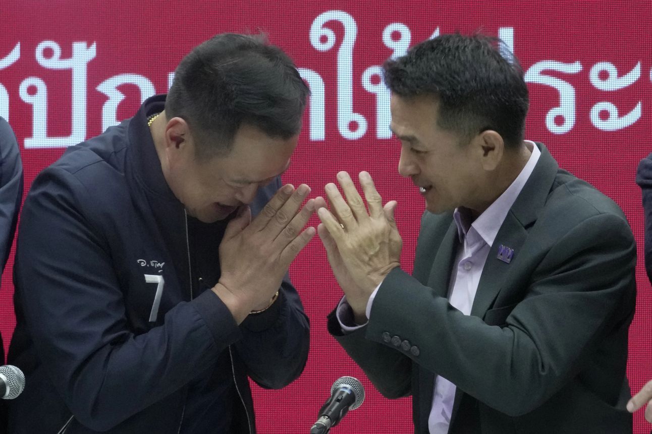 Leader of Bhumjaithai Party Anutin Charnvirakul, left, and Leader of Pheu Thai party Chonlanan Srikaew after announcing they’d formed a coalition. Photo: Sakchai Lalit/AP