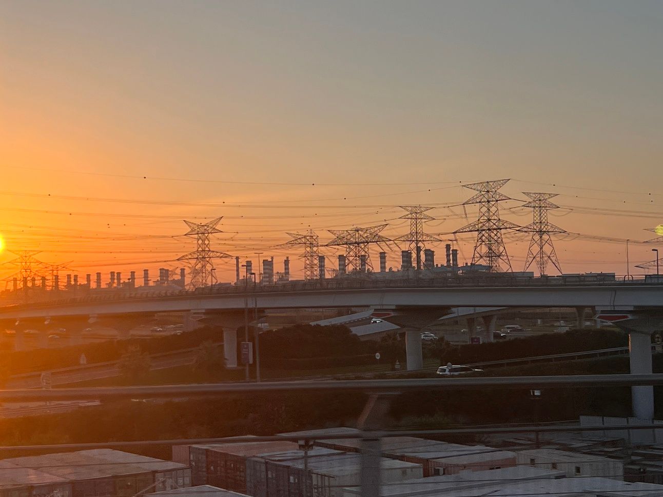 Gas- and oil-fired power stations line the shore of Dubai, where climate activists and delegates gathered to promote a fossil-fuel-free future. Photo: Dan Keeler