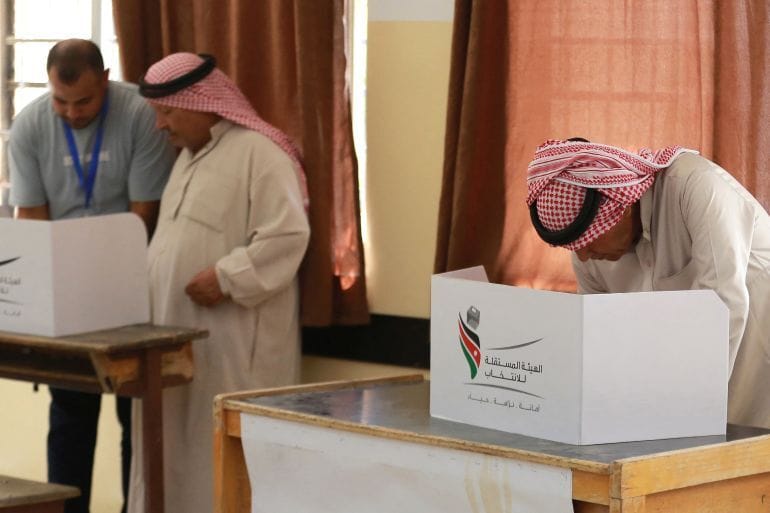 Jordanians vote at a polling station near the capital Amman. Photo: Khalil Mazraawi/ AFP