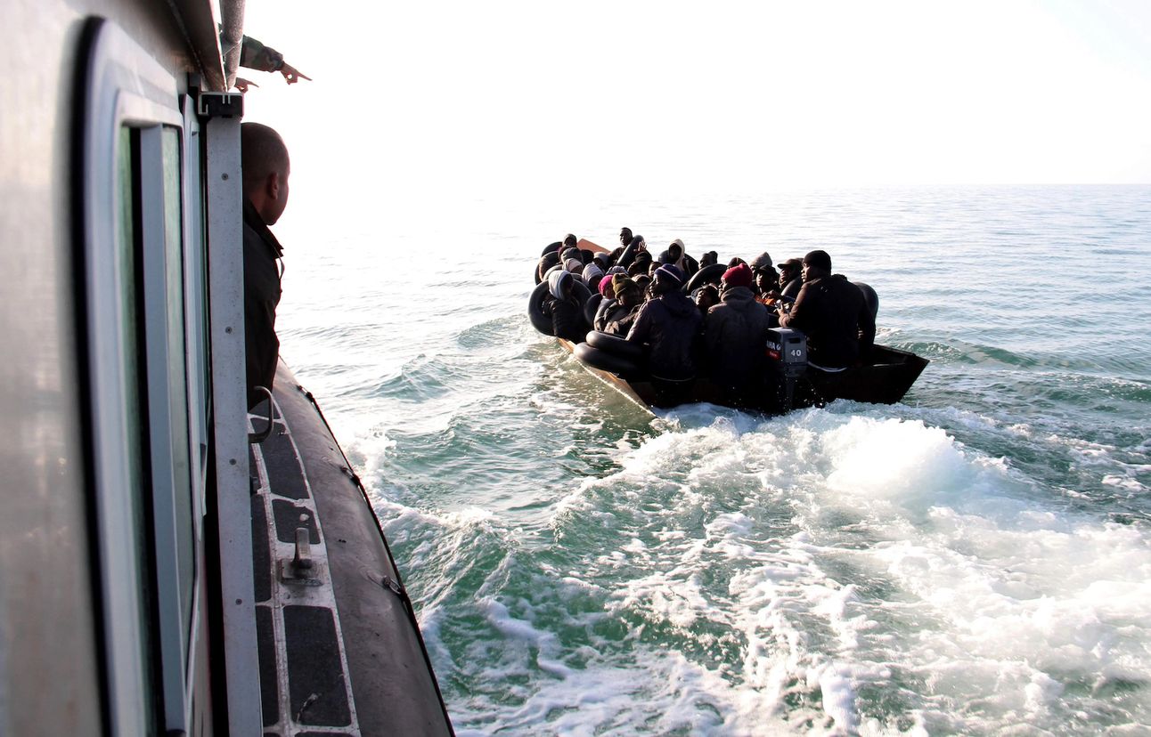 A Tunisian coast guard vessel approaching a migrant boat near the Tunisian coast in April. Photo: AP