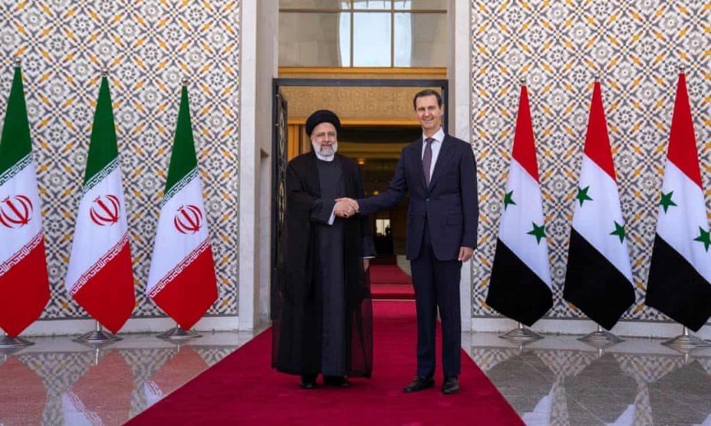 Bashar al-Assad (right) receives his Iranian counterpart, Ebrahim Raisi, at the presidential palace in Damascus on Wednesday. Photo: Iranian Presidency/AFP/Getty