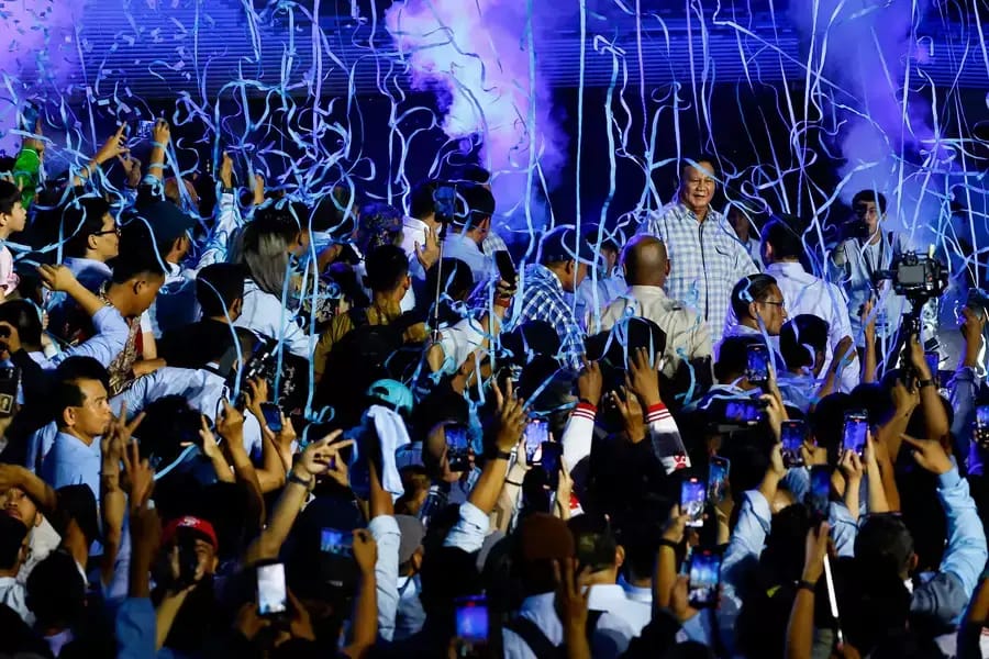 Supporters gather around Prabowo as he claims victory during an election-watching event. Photo: Kim Kyung-Hoon/Reuters