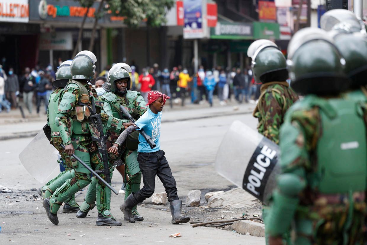 Kenyan police detain a young man during a demonstration over the handling of anti-tax protests. Simon Maina/AFP file photo