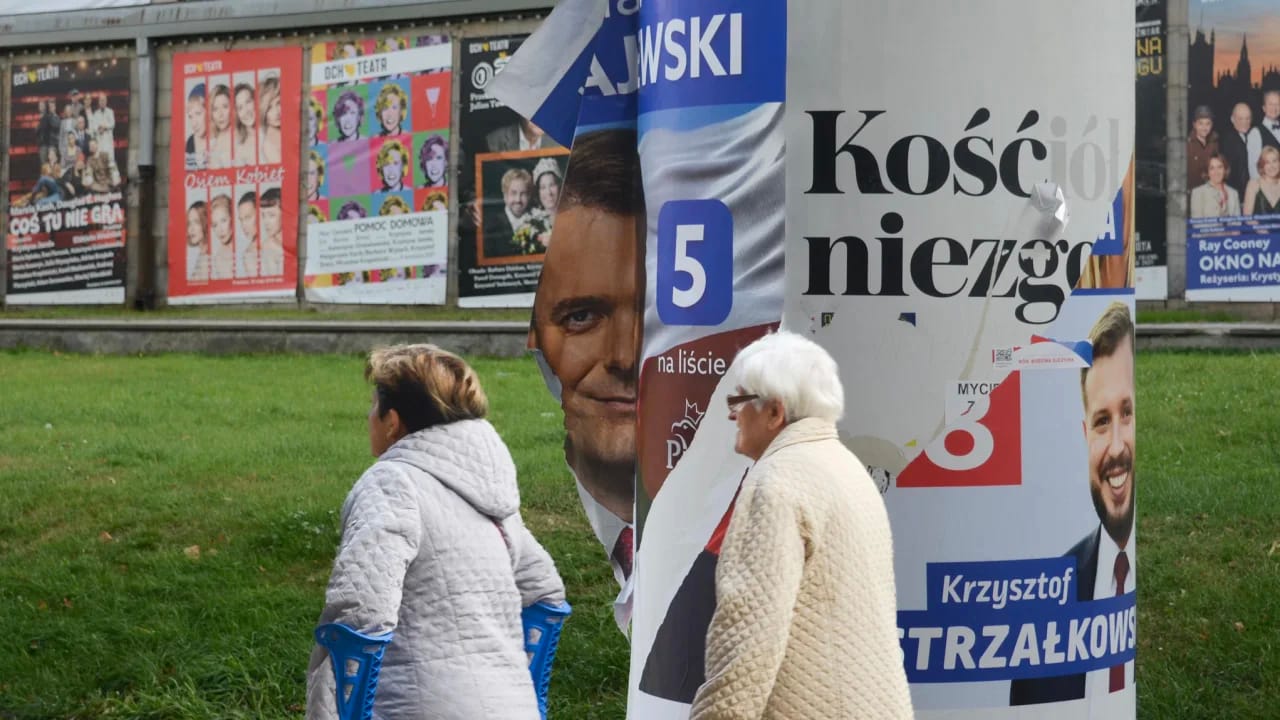 A defaced poster for a PiS candidate in Warsaw. Poland’s election campaign has been toxic, with polls indicating a tight result. Photo: Rob Picheta via CNN
