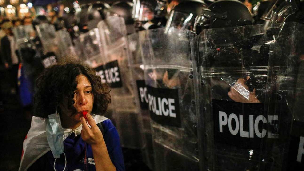 A protester confronts police during the demonstration against the ‘foreign agents’ law. Photo: David Mdzinarishvili/EPA-EFE/Shutterstock